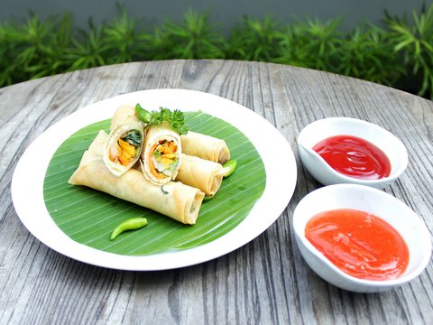 a plate of food on a wooden table