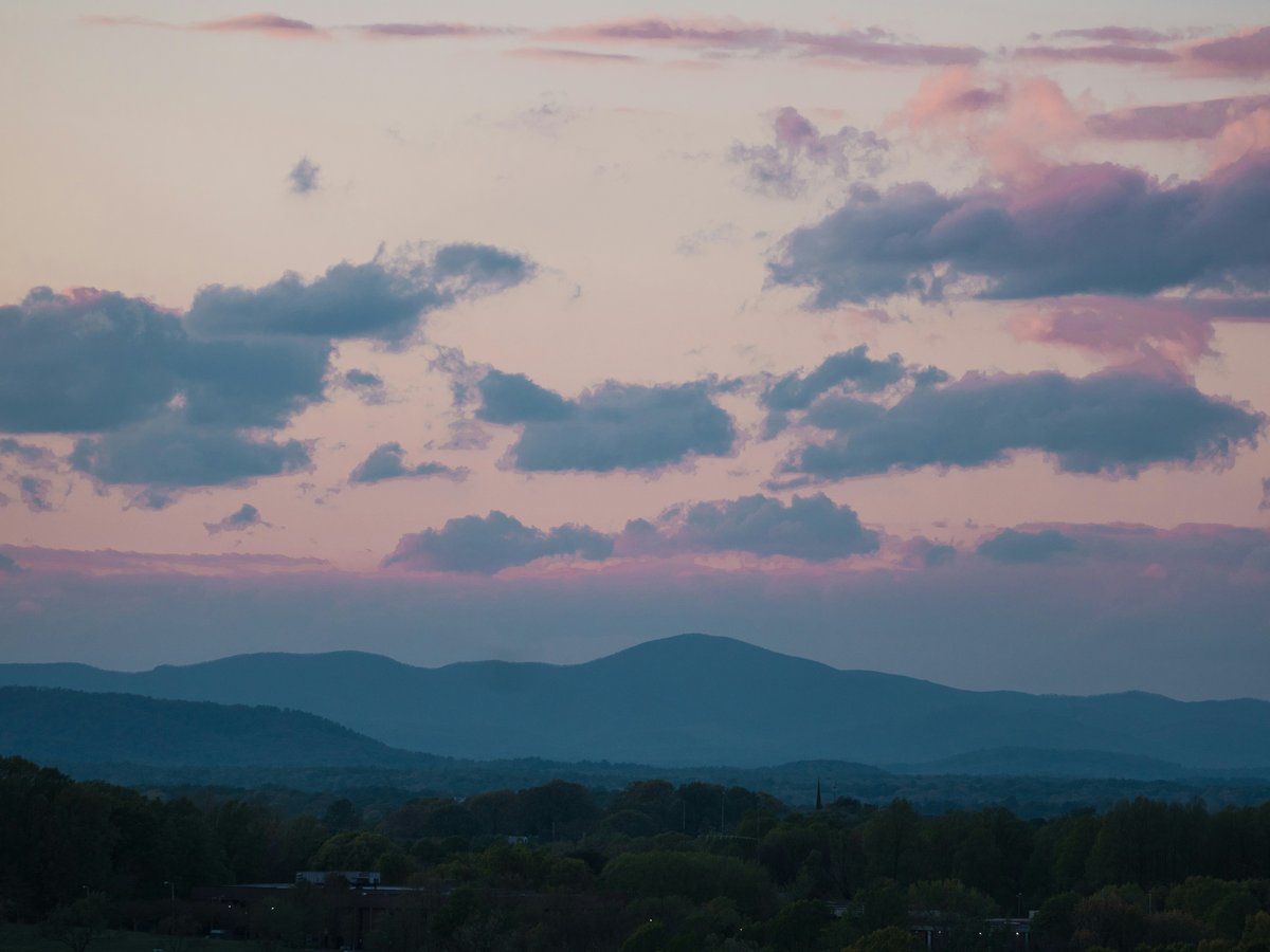 a view of a mountain range at sunset