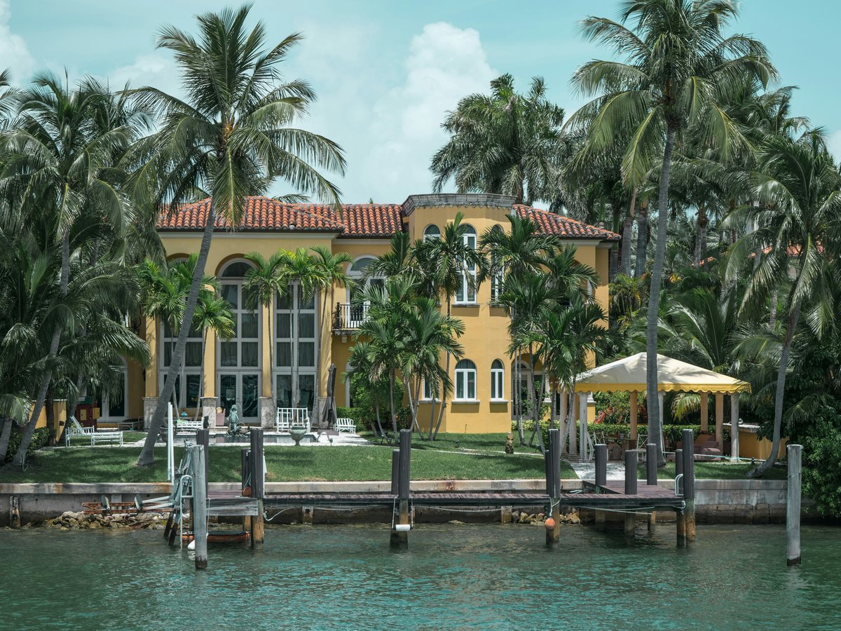 people walking on dock near building during daytime