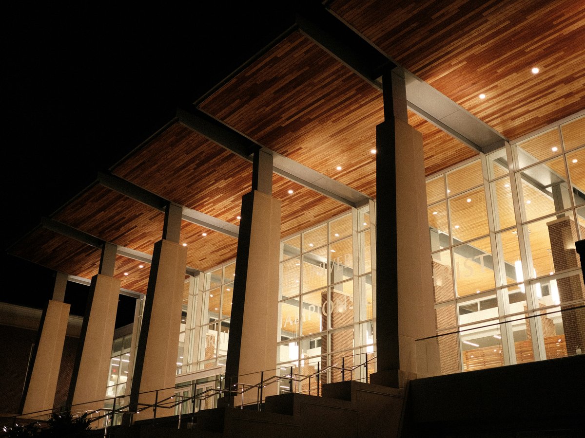 a building with a lot of windows at night