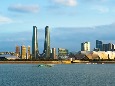 A large body of water with a city in the background