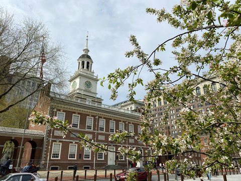 a large building with a clock tower with Maryland State House in the background