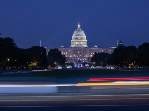 United states capitol building at night with light trails