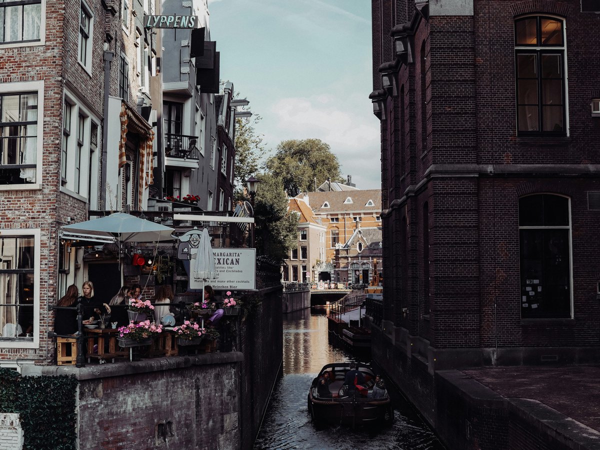a boat is going down a narrow canal