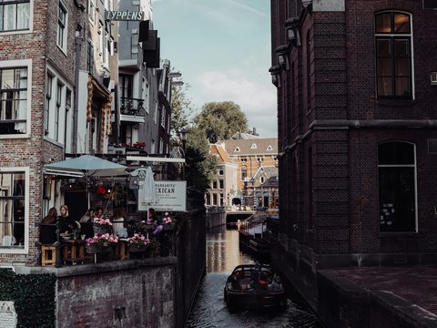 a boat is going down a narrow canal