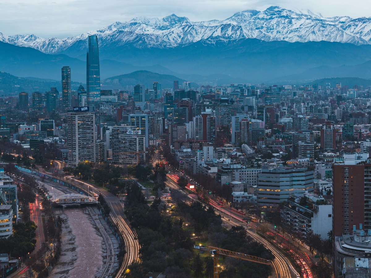 a view of a city with mountains in the background