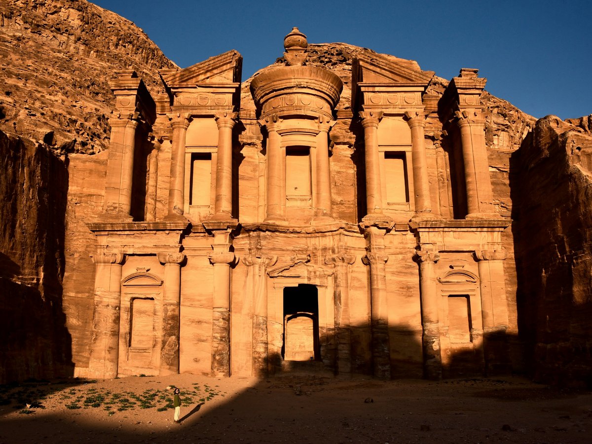 a large stone building in the middle of a desert