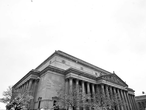 a black and white photo of a building with columns