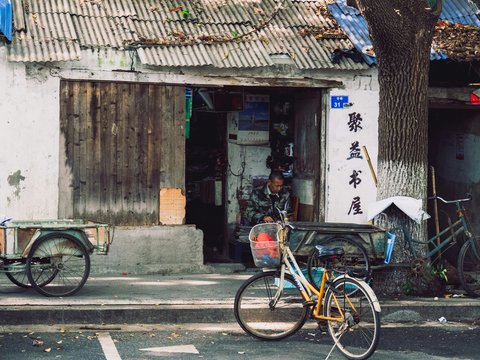 Two bicycles parked in front of a building