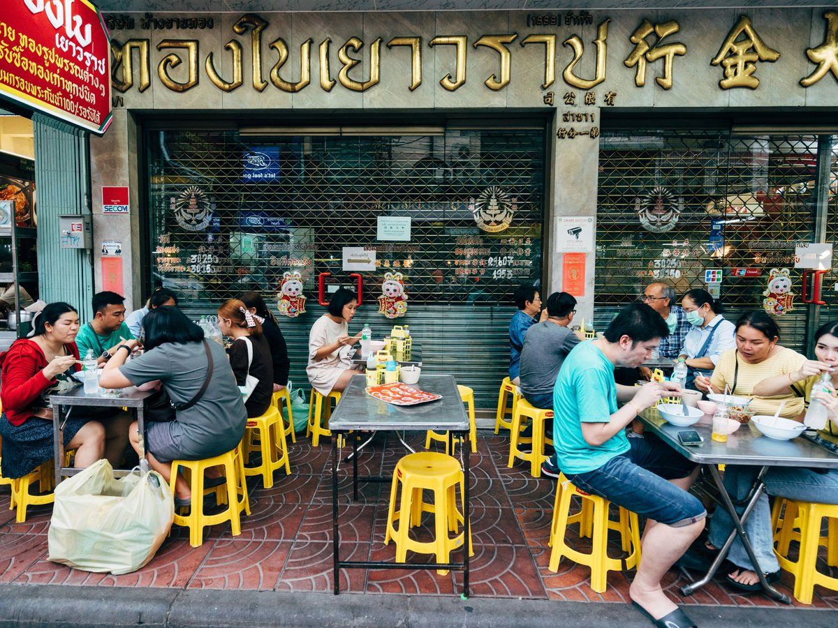 a group of people sitting at tables