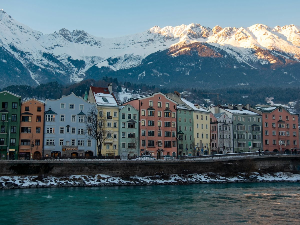 a group of buildings next to a body of water