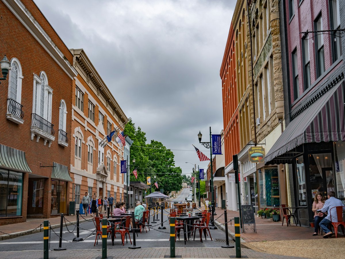 a street with buildings and people