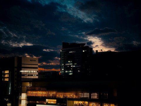 City skyline with illuminated buildings at dusk