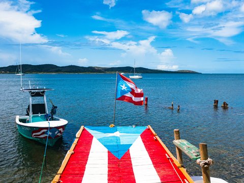 a flag on a boat in the water