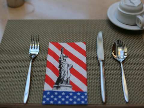 silver fork and bread knife on white ceramic plate