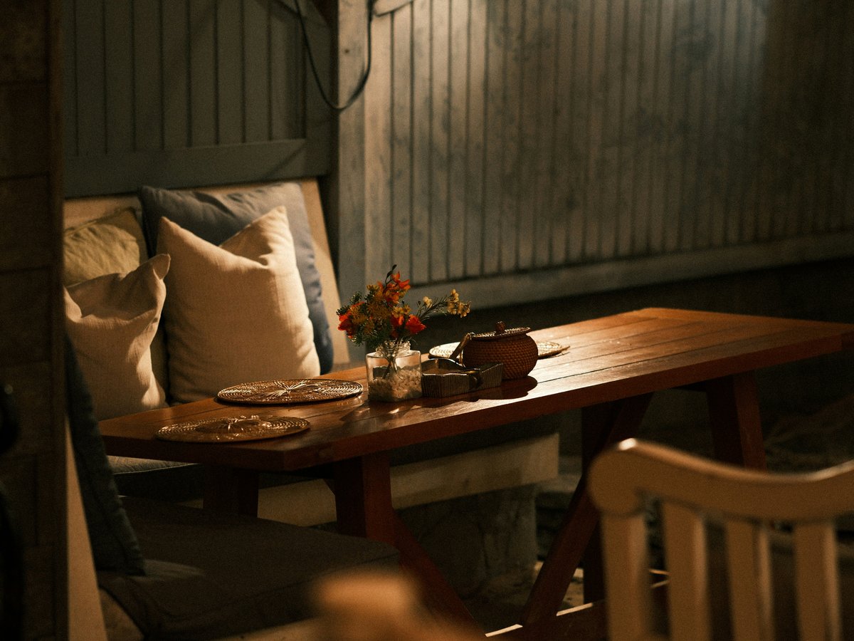 A cozy outdoor dining table is set
