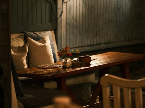 A cozy outdoor dining table is set