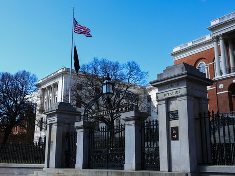 A building with a gate and a flag on top of it