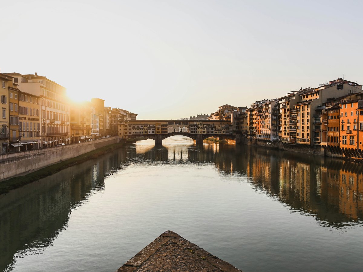 body of water between buildings during daytime