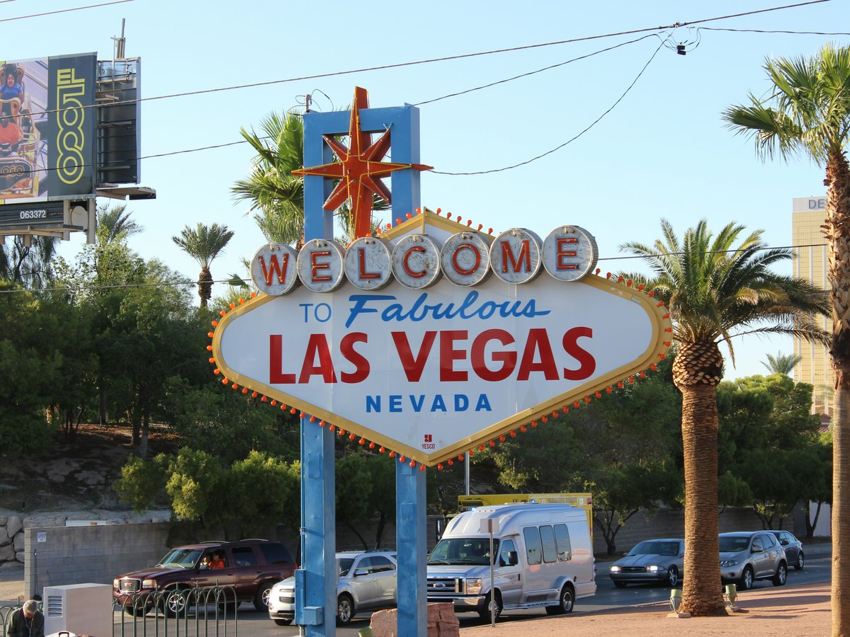 a welcome to fabulous las vegas sign on the side of the road