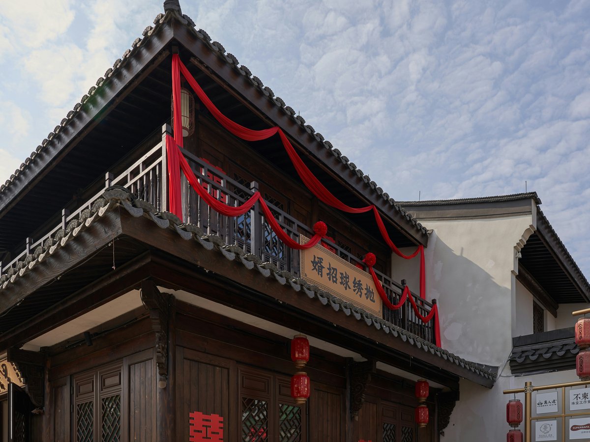 a building with a red ribbon on the top of it