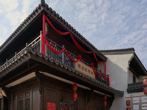 a building with a red ribbon on the top of it
