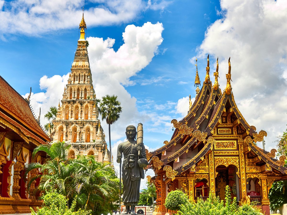 standing statue and temples landmark during daytime
