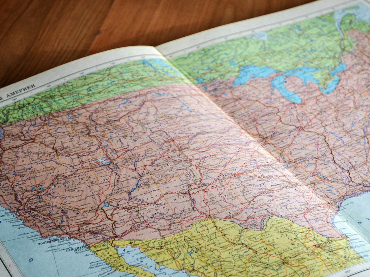 country map on brown wooden surface