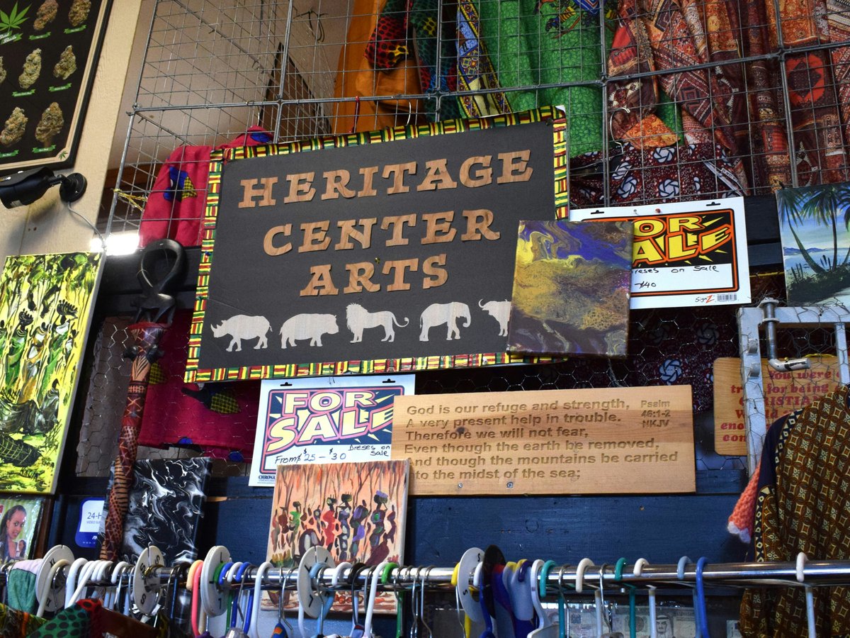 a store with a sign that says heritage center arts