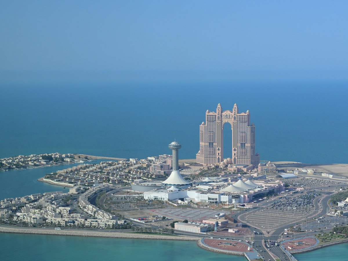 Modern city skyline with distinctive architecture on the coast.