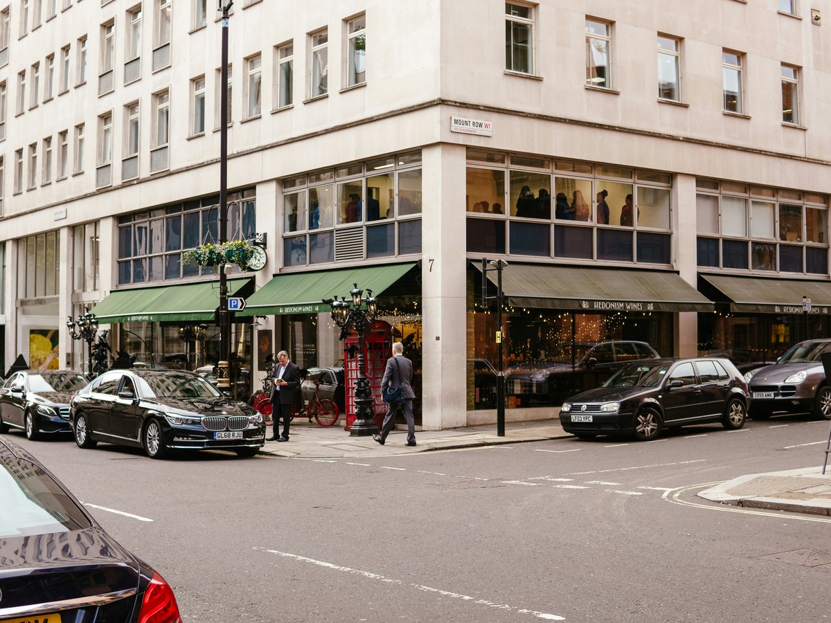 a group of cars parked outside a building