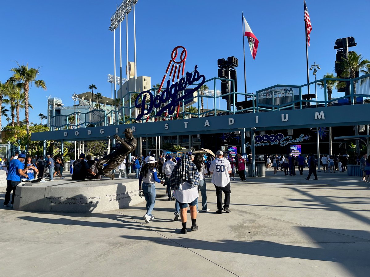 People entering dodger stadium before a game.