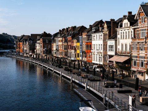 body of water between buildings during daytime
