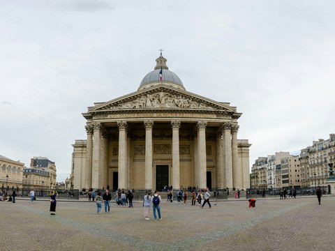 a group of people standing in front of a building