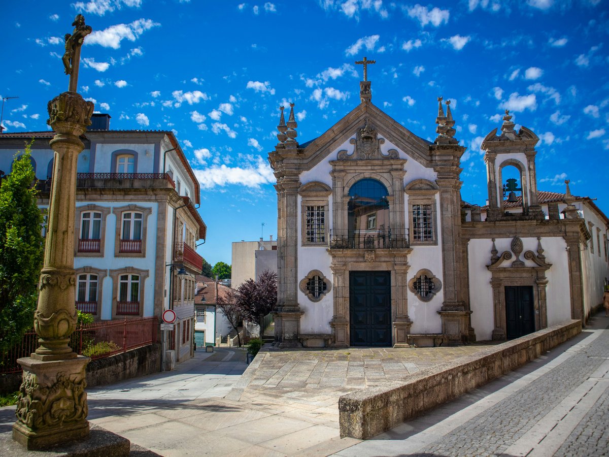 a large building with a cross on the top of it