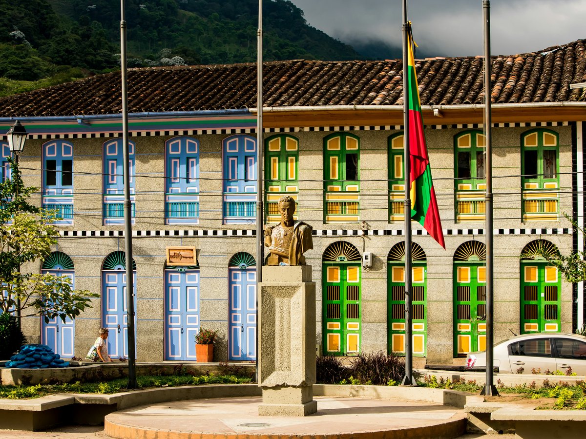 a statue in front of a building
