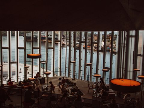 people sitting on chairs inside building