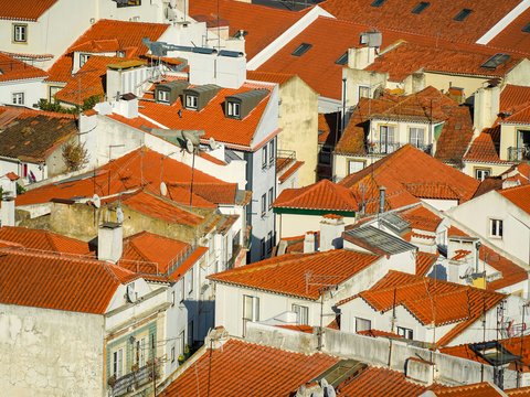 a view of a group of buildings with red roofs