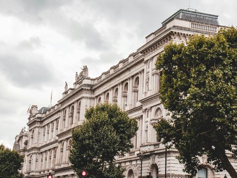 a large building with trees in front of it
