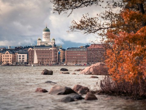 a body of water with a large building in the background