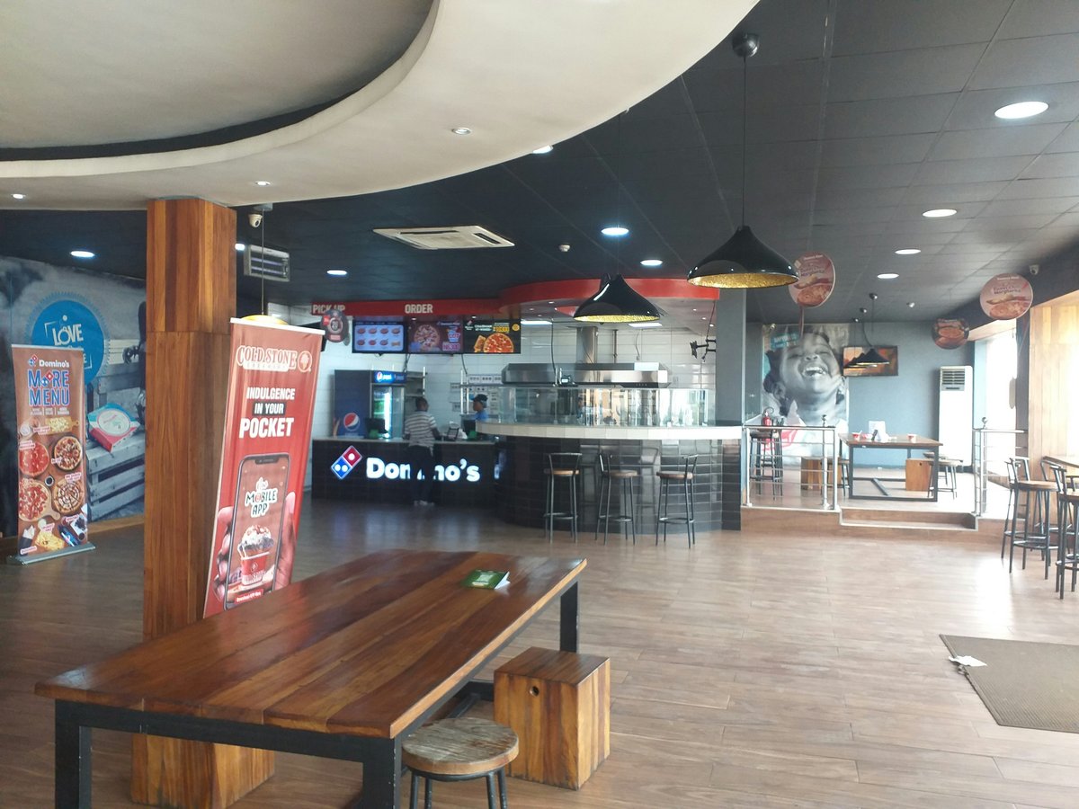 the inside of a restaurant with tables and chairs