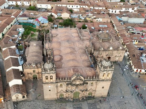 An aerial view of a city with a large building