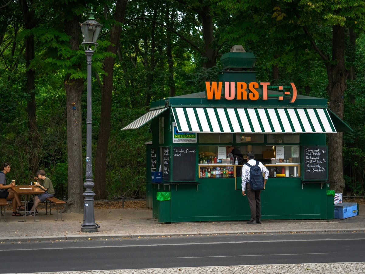 a person standing in front of a restaurant