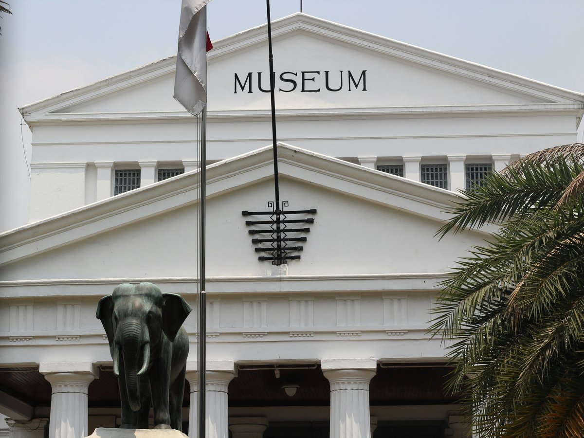 a building with a statue of an elephant in front of it
