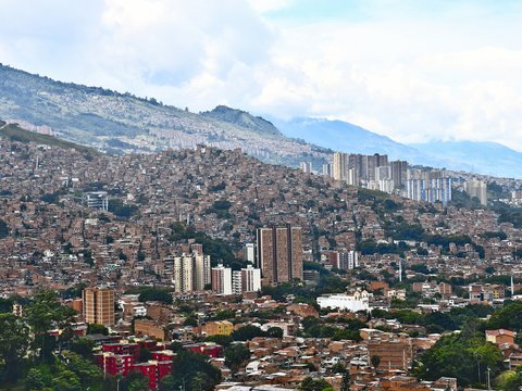 a city with mountains in the background