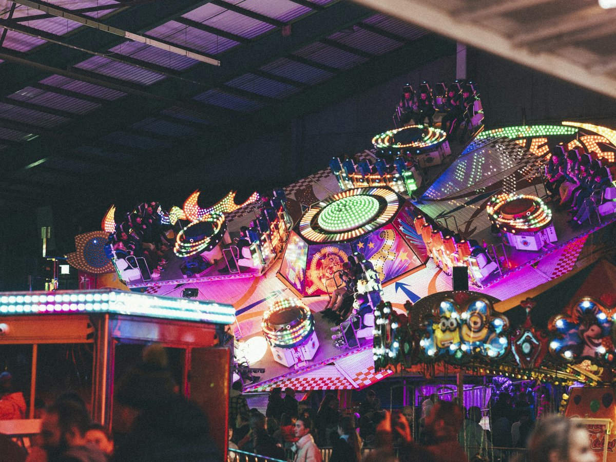 a carnival ride with lights and decorations on it