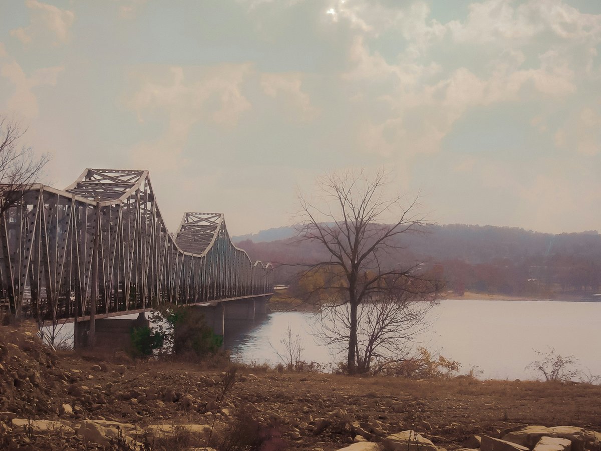brown wooden bridge over river