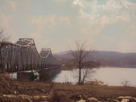 brown wooden bridge over river