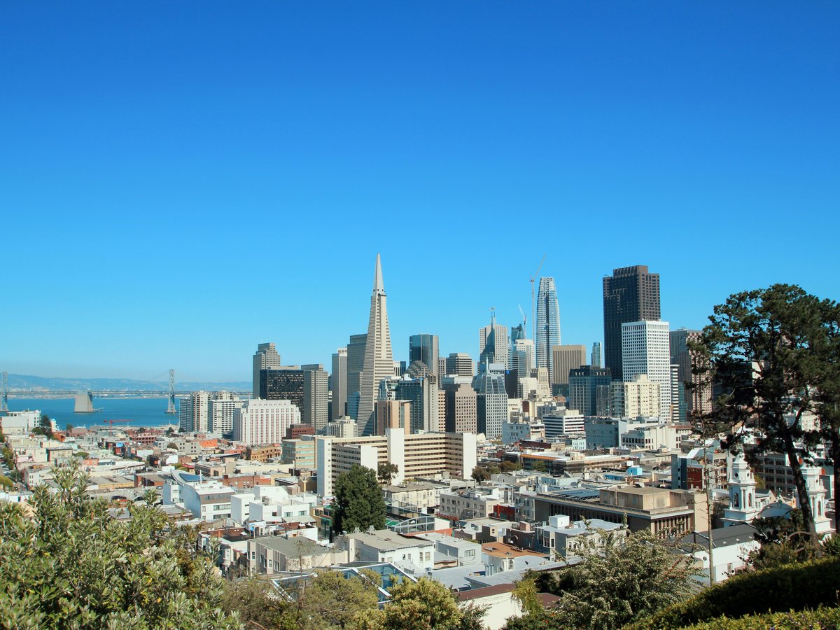 city skyline under blue sky during daytime