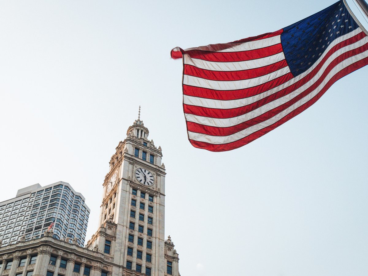 us a flag on top of building